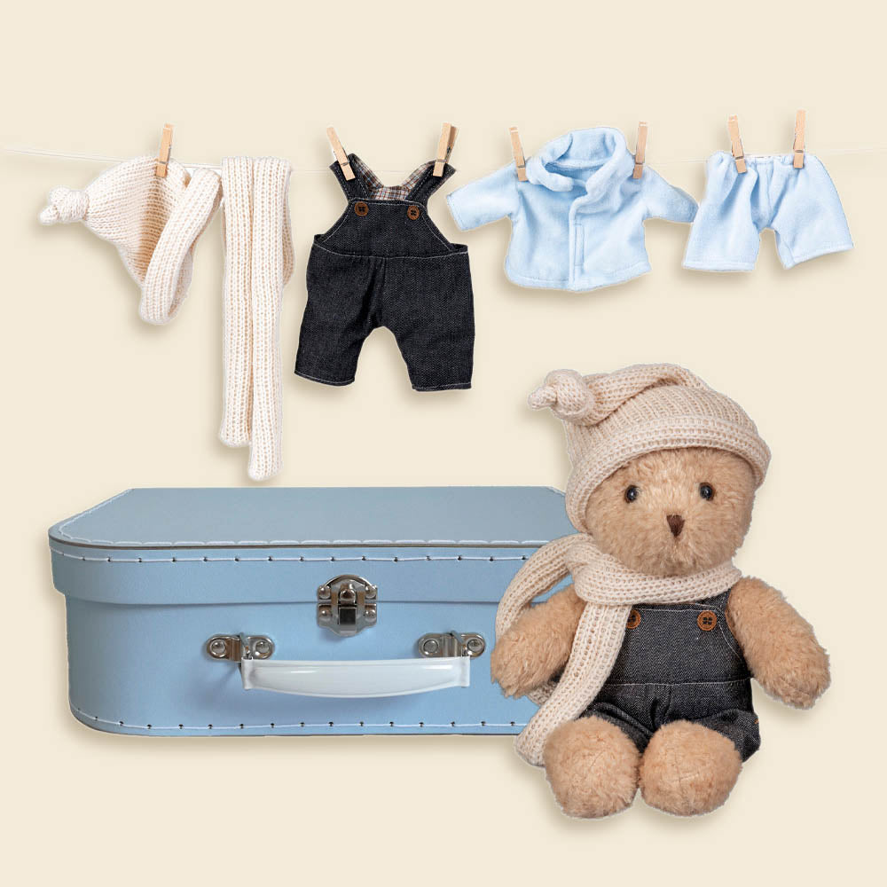 Morris bear with clothes in a case