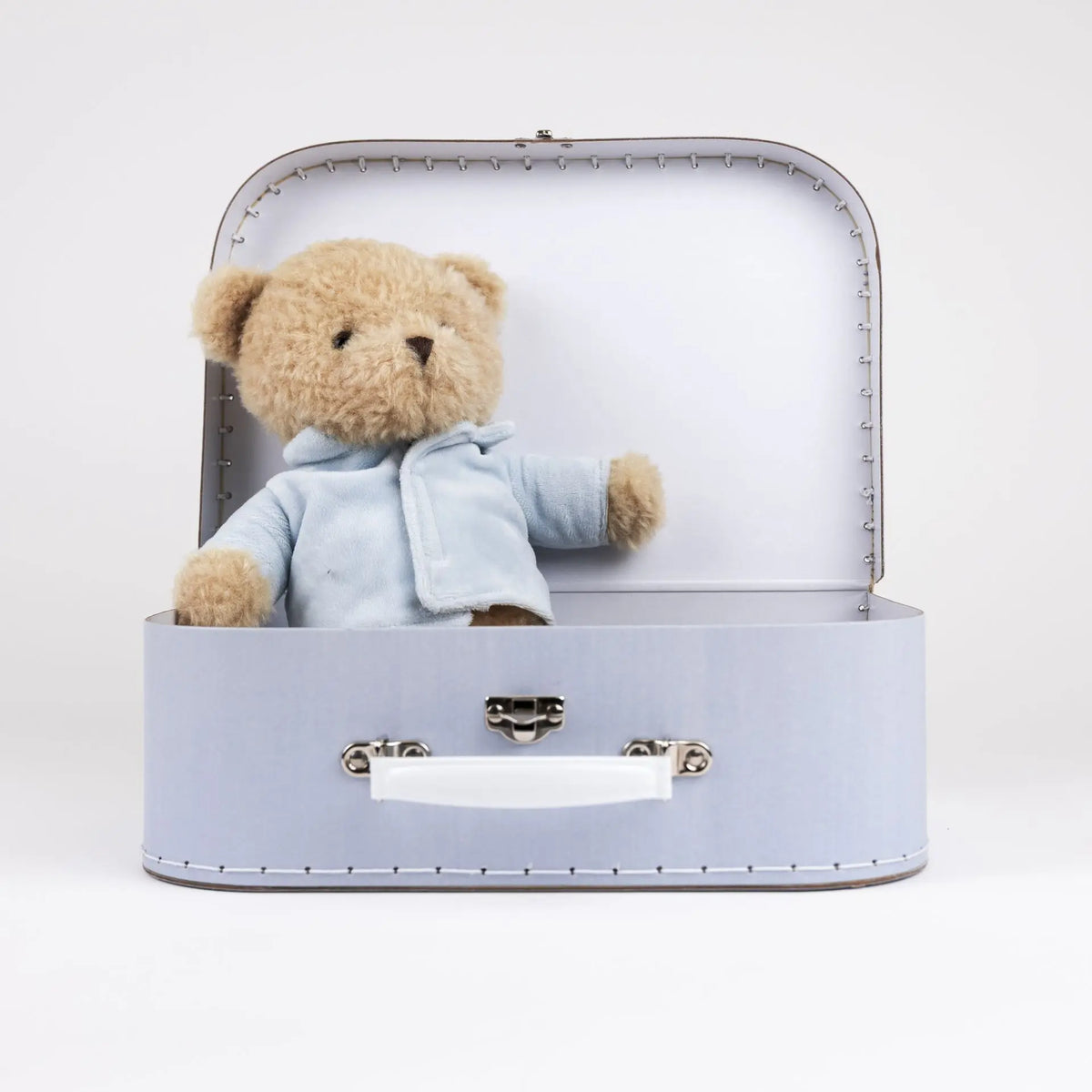 Morris bear with clothes in a case